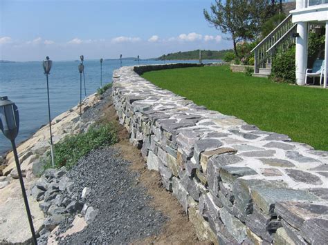 8 Freestanding and Retaining Stone Wall Designs That Will Add Dimension ...