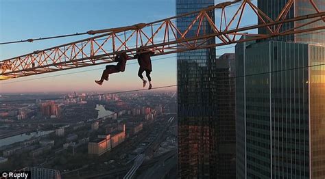 Terrifying Video Shows Russian Pair Hanging From A Crane Above Moscow