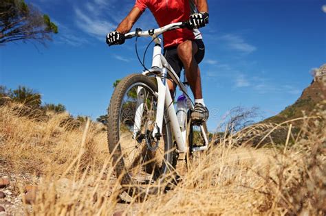 Cyclist Riding The Bike On The Beautiful Mountain Trail Stock Image