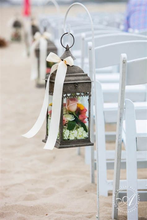 Beach Wedding Aisles Wooden Lanterns With Flowers Lining The Aisle