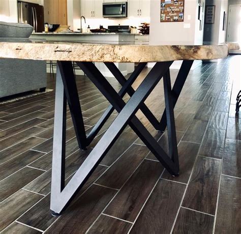 A Wooden Table Sitting On Top Of A Kitchen Floor