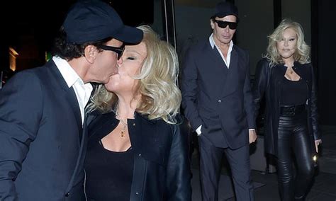 Catwoman Jocelyn Wildenstein shows off her shares a kiss with fiancé