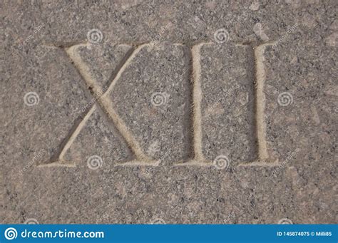 Roman Numeral Twelve Carved In Stone Stock Image Image Of Carved