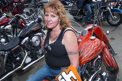 Woman Rider Sitting On Her Bike In The City Of Sturgis In South Dakota Usa During The Annual