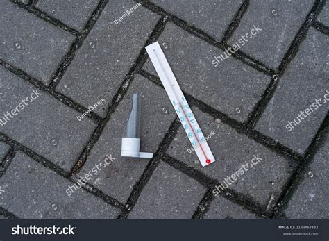 Broken Mercury Thermometer Lying On Pavement Stock Photo Edit Now