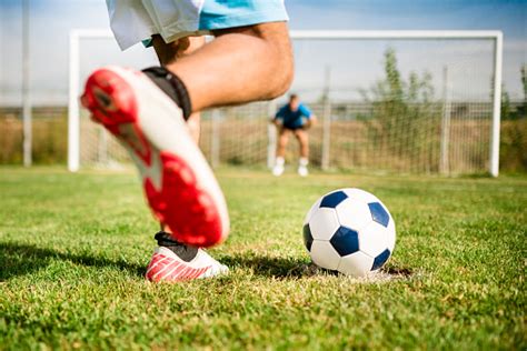Soccer Player Kick The Ball At The Penalty Stock Photo Download Image