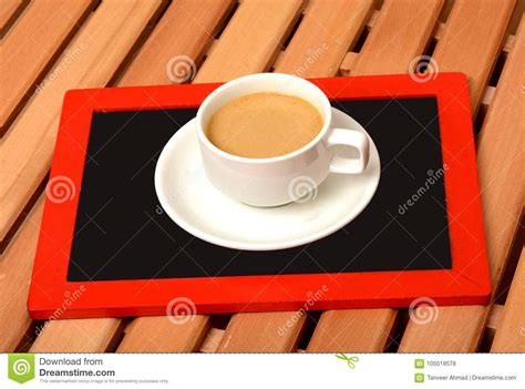 Cup Of Tea On Top Of Chalkboard In Office Stock Photo Image Of Spoon