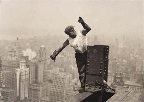 empire state building worker signaling on high beam 1930 empire state building empire state