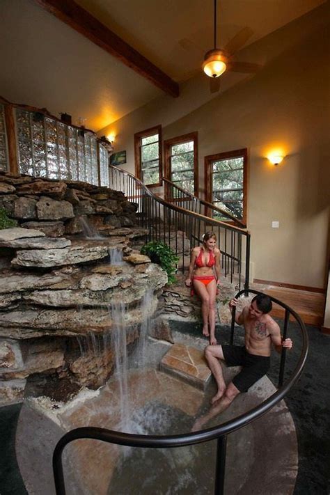 The room features white carpet flooring. Indoor water feature awesome! | Home Ideas | Pinterest