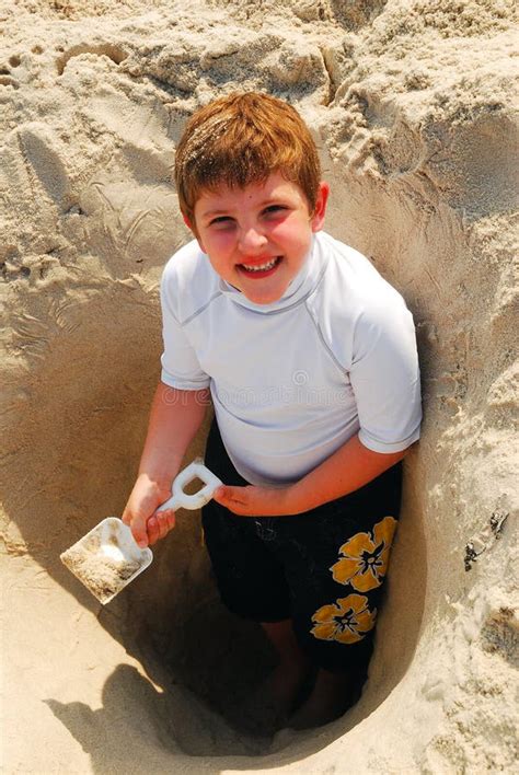 174 Boy Digging Hole Beach Stock Photos Free And Royalty Free Stock