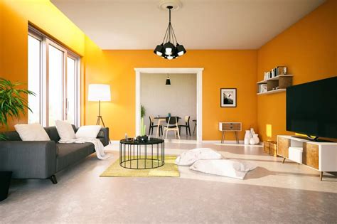 The Living Room Is Painted Bright Yellow And Has White Furniture Black