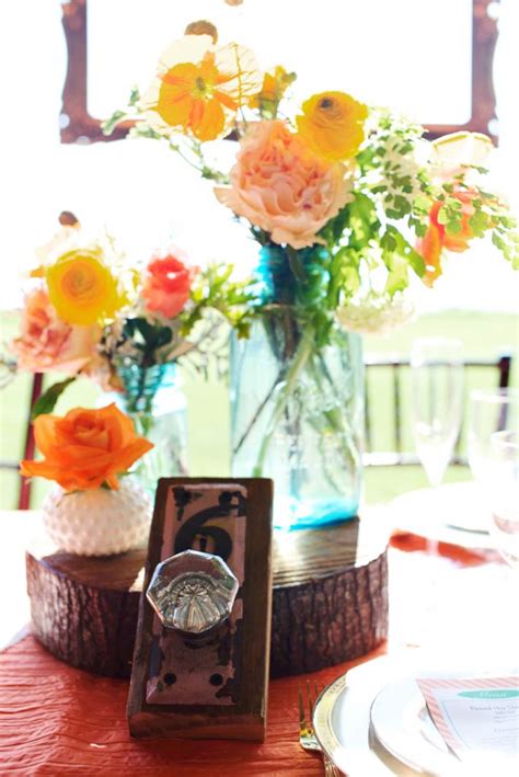 Actually, no matter about seasons, fresh flowers are always the major element of wedding centerpiece decorations. Rustic Wedding with a Tangerine Twist | OneWed