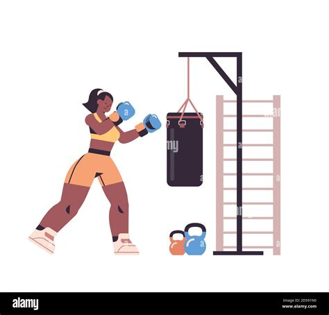Female Boxer Doing Exercises With Punching Bag Training Healthy