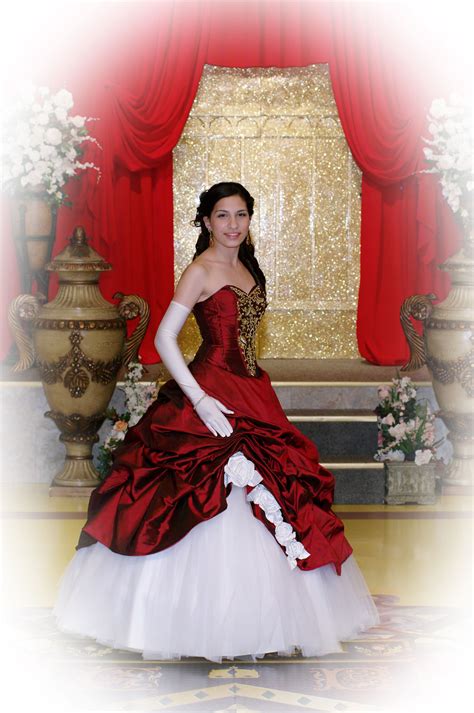The Quinceanera Wore A Dramatic Dark Burgundy Ballroom Gown With Full