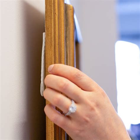 How To Hang A Painting Without Damaging The Wall Prism Specialties