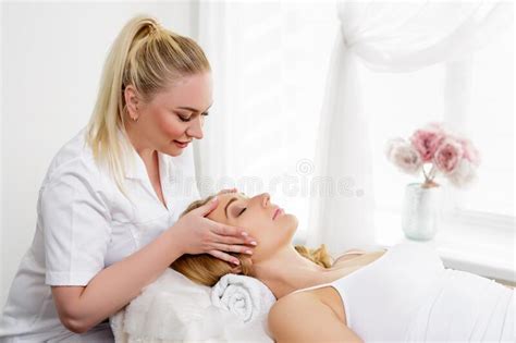 Spa Resort Beauty And Health Concept Female Masseur Or Beautician And Beautiful Woman Client