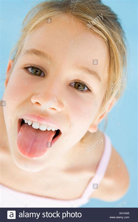 Young Girl Sticking Her Tongue Out Stock Photo Alamy