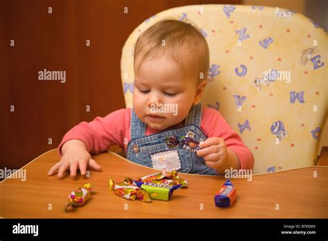 Eight Month Old Baby Sitting In High Chair Stock Photo Alamy
