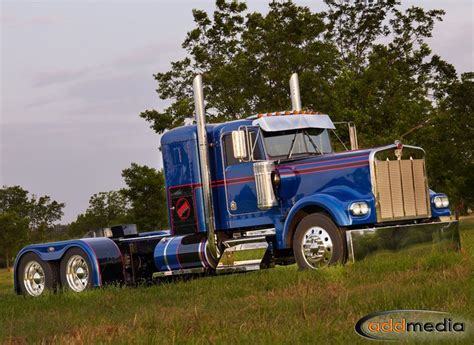 A Fully Tricked Out And Restored Kenworth W900b Parked Near 4state