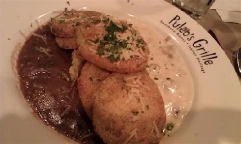Fried Green Tomatoes From Puleos Grille Piled On Cheese Grits With