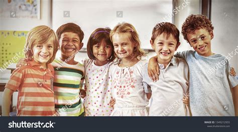 Portrait Happy Schoolchildren Standing Classroom Stock Photo 1349212955
