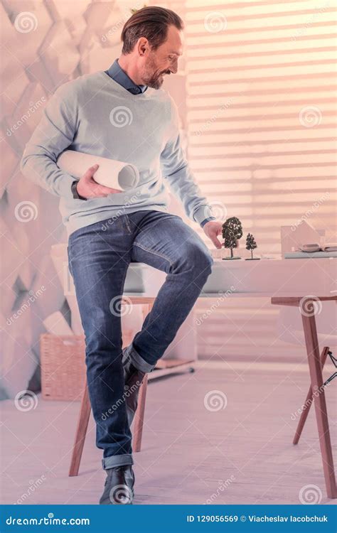 Joyful Brunette Man Sitting On The Table Stock Image Image Of
