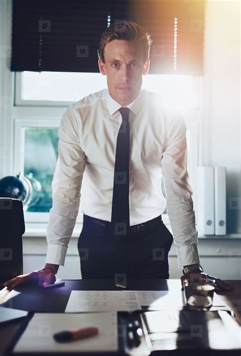 Executive Business Man Standing At Desk At Office Stock Photo 147244