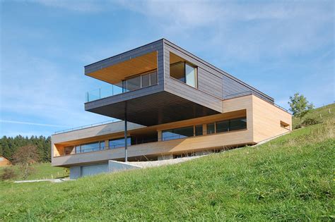 A Cantilevered Home Overlooking A Lake In Austria