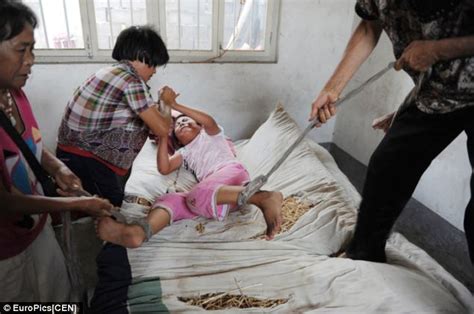 Shocking Images Of Chinese Girl Tied To Her Bed By Her Own Mother