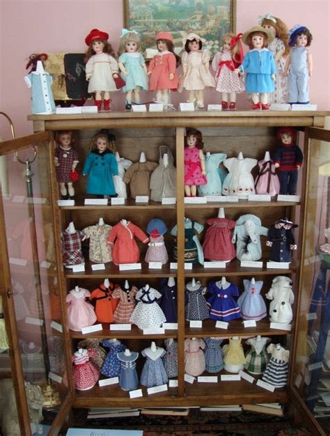 There Are Many Dolls On The Shelves In This Room