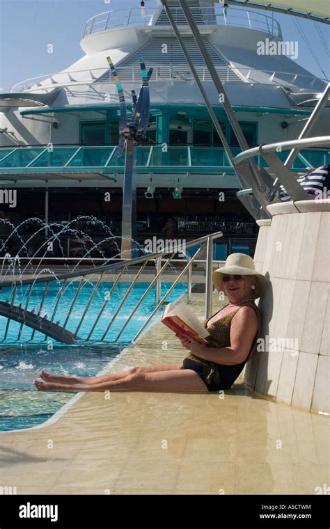 woman relaxing at swimming pool aboard the royal caribbean cruise lines rcl vision of the seas