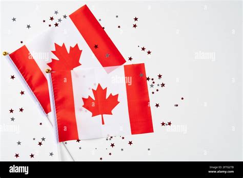Happy Canada Day Concept National Flags Of Canada And Confetti On White Background Canada