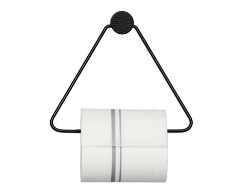 Repurposed magazine holder turned toilet paper storage. Ferm Living Black Toilet Paper Holder