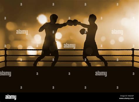 Silhouette Of Two Professional Asian Boxer Fight In The Boxing Match