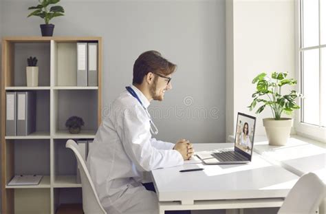 Doctor Having Online Consultation With Patient Via Video Call On Laptop