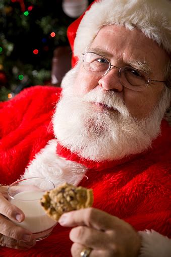 Santa Claus With Milk And Cookies Stock Photo Download