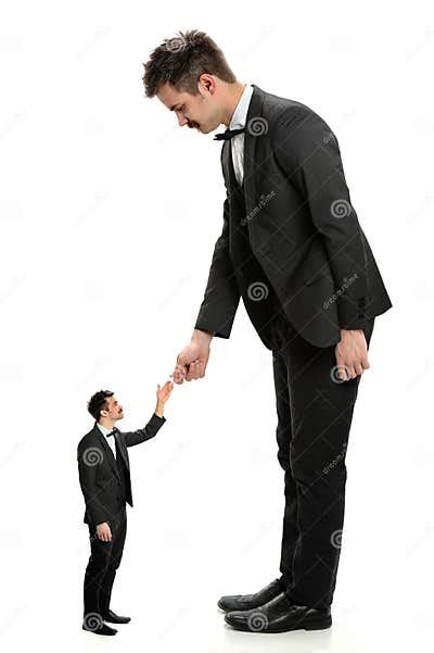 Giant Businessman Shaking Hands With Small Man Stock Image Image Of