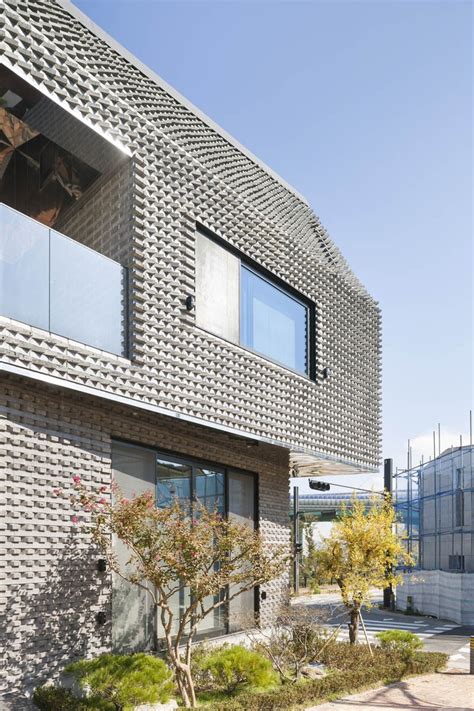 Angled Bricks Make The Exterior Of This House Textured And Prickly