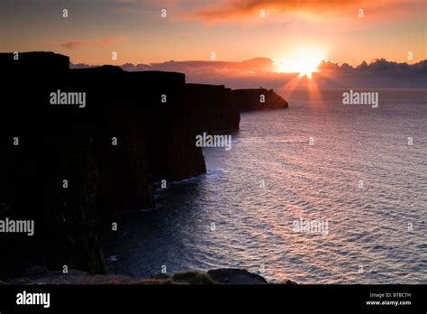 Sunset Over The Cliffs Of Moher In County Clare Ireland Stock Photo
