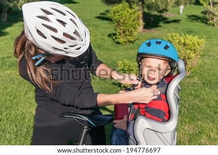 Protection On The Bicycle Caucasian Mother Have Biking Helmet And Putting Biking Helmet On