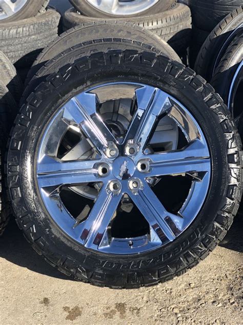 22” Chrome Chevrolet Wheels On A Set Of 2855022 Nitto Ridge Grapplers