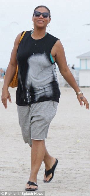 Queen Latifah Holds Hands With A Male Friend As They Drink Champagne And Frolic On The Beach In