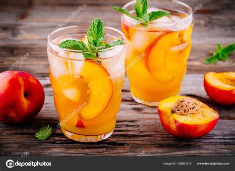 Summer Cold Drinks Homemade Peach Lemonade With Ice Cubes And Mint In