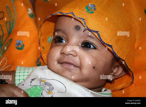 Indian Baby Girl Emitting Glowing And Enchanting Smile Stock Photo Alamy