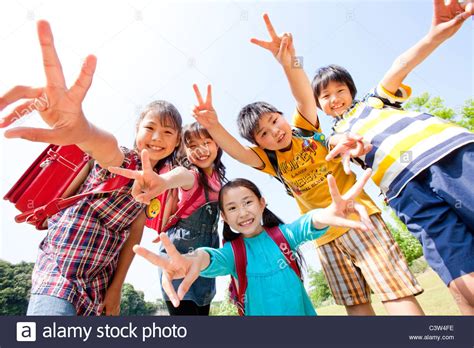Five Schoolchildren Doing Peace Sign Stock Photo Alamy
