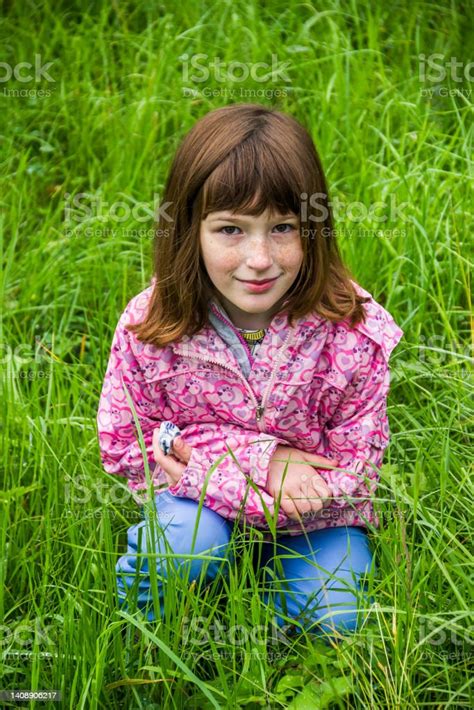 A Happy Girl On The Green Meadow Stock Photo Download Image Now