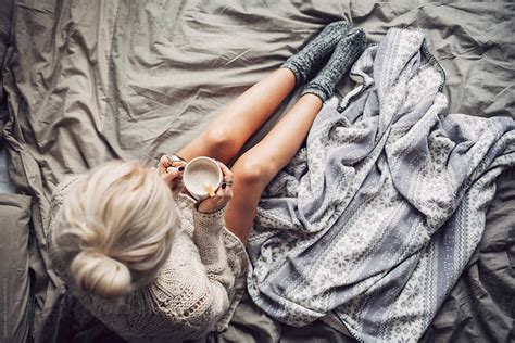 Woman Drinking Hot Coffee In Bed In The Morning By Stocksy Contributor Lumina Stocksy