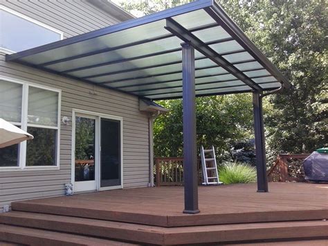 Bronze with green panels. | Pergola patio, Pergola, Covered patio design