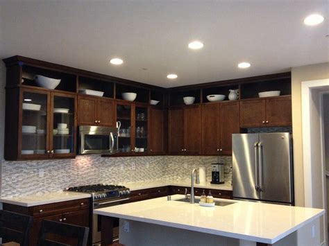 Here, for example, four ovens have been installed into the row of cabinets. Extending Wall Cabinets in the Kitchen | Above kitchen cabinets, Kitchen cabinets to ceiling ...