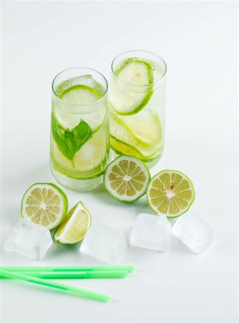 Free Photo Lemonade With Lemons Straws Basil Ice Cubes In Glasses